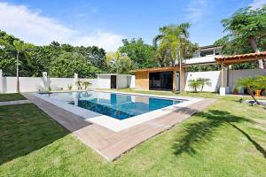 a swimming pool in the backyard of a house at Casa Corales Dreams 1 in Playa Flamingo +9 photos
