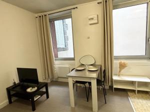 Un televizor și/sau centru de divertisment la Studio au coeur de Clermont-Ferrand proche de la Cathédrale