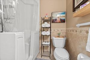 a bathroom with a white toilet and a shower at Cozy 2.4 in Hayden
