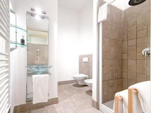 a bathroom with a sink and a toilet at Voltiva House - in the Heart of Como Old Town in Como +19 photos