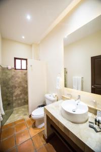 a bathroom with a sink and a toilet and a shower at Villa Lavanda in San Miguel de Allende +15 photos