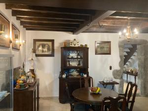 a kitchen with a table and a dining room with a table and chairs at Casa da Música BR in Furnas
