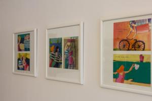 a group of pictures hanging on a wall at Apartment Bambi in Mali Lošinj