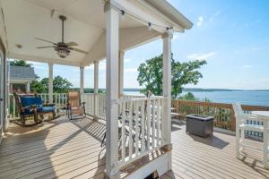 a white porch with a view of the water at CrossTimbers Marina and Cottages in Sperry