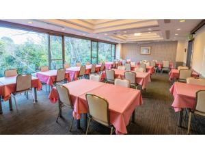 a conference room with red tables and chairs at Le Nessa Akazawa - Vacation STAY 03714v in Futo +39 photos