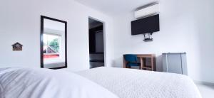Rúm í herbergi á Hotel Suma Wasi