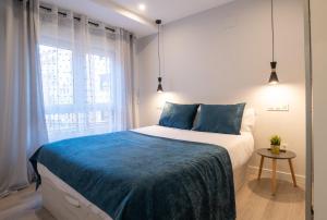 Posteľ alebo postele v izbe v ubytovaní Apartamentos Aranda - La Cepa I - II