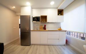 Kuchyňa alebo kuchynka v ubytovaní Apartamentos Aranda - La Cepa I - II
