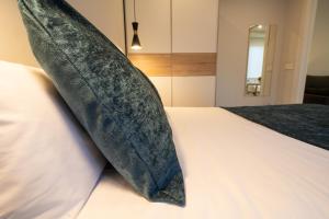 Posteľ alebo postele v izbe v ubytovaní Apartamentos Aranda - La Cepa I - II