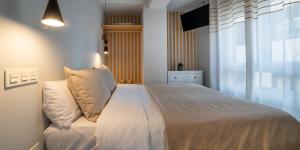 Posteľ alebo postele v izbe v ubytovaní Apartamentos Aranda - La Cepa I - II