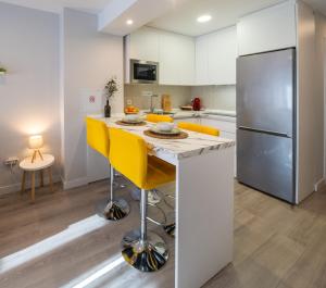 Kuchyňa alebo kuchynka v ubytovaní Apartamentos Aranda - La Cepa I - II