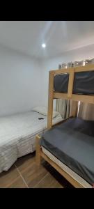 a bedroom with two bunk beds next to each other at Casa en cineguilla in Cieneguilla +31 photos