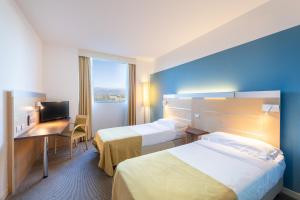 Postel nebo postele na pokoji v ubytování Meditur Hotel Udine Nord + 37 fotografií