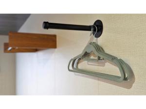 a glass holder hanging on a wall at Yonagunijima Hotel Munbu Stay Kukomae - Vacation STAY 11812v in Sonai +15 photos