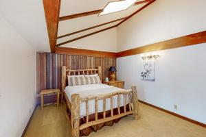 a bedroom with a wooden bed in a room at Wister C in Teton Village