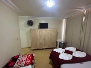 Postel nebo postele na pokoji v ubytování POUSADA DO NIVINHO
