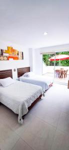 Rúm í herbergi á Hotel Suma Wasi