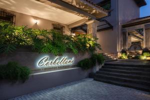 a sign on the side of a building with plants at Casa Corbellani in Asuncion