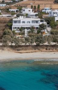an aerial view of a white house on a beach at Thalassa Naxos in Kastraki