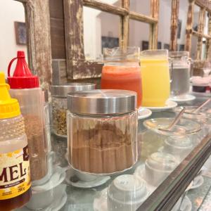 a glass counter topped with different types of food at Pousada Suítes Do Pelô in Salvador
