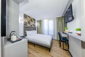 Postel nebo postele na pokoji v ubytování Dedem Hotel Premium - Çorlu