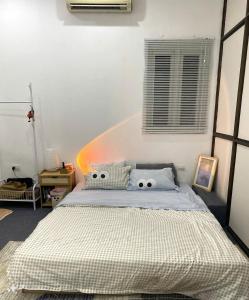 Postel nebo postele na pokoji v ubytování Luami Homestay