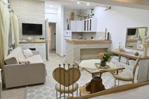a living room with a couch and a table at Apartman Teo in Požarevac