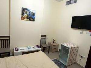 TV a/nebo společenská místnost v ubytování MBZ - Master Room