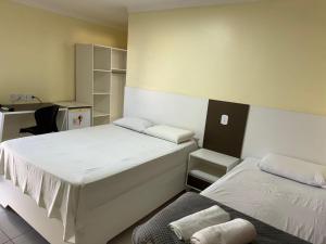 Postel nebo postele na pokoji v ubytování Hotel Serra do Rio + 37 fotografií
