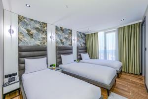 Postel nebo postele na pokoji v ubytování Dedem Hotel Premium - Çorlu