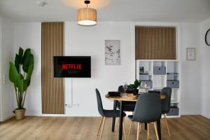 a dining room with a table and chairs at CloudCabins Dornstetten - Marktplatz in Dornstetten