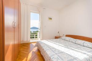 Ένα ή περισσότερα κρεβάτια σε δωμάτιο στο Apartments Angel