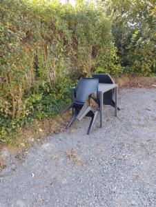 two chairs and a table on the ground at La room in Joue-les-Tours +2 photos