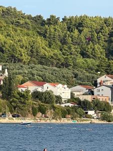 a town on the shore of a body of water at Apartments Klara in Podaca