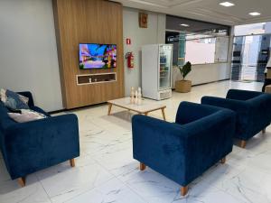 TV a/nebo společenská místnost v ubytování Hotel Serra do Rio