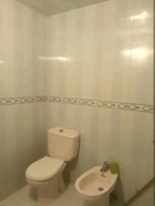 a bathroom with a toilet and a sink at Lovely and simple Appartement in centre of Martil in Martil