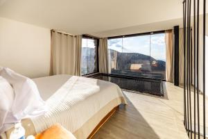 Postel nebo postele na pokoji v ubytování Hotel El Templo