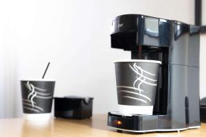 Kemudahan buat kopi dan teh di Pear Tree Inn Cape Girardeau Medical Center +8 gambar