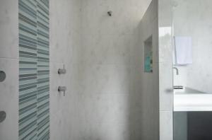 a bathroom with a shower and a sink at House on the Hillside with City Views Sleeps 12 in Howrah