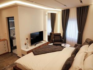 TV a/nebo společenská místnost v ubytování Hotel Europa 92 + 12 fotografií