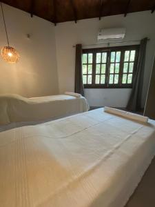 Voodi või voodid majutusasutuse Cabaña 8 vientos toas