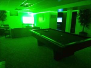 a green room with a pool table in it at Charles Stays in Kansas City