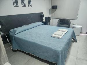 Hotel El Paraiso Boutique客房内的一张或多张床位