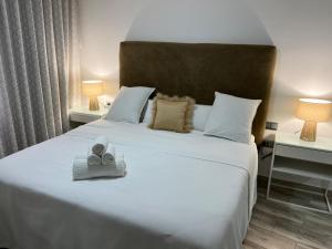 Postel nebo postele na pokoji v ubytování DON LEONE Hotel