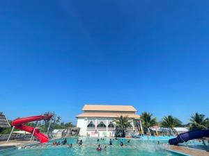 a group of people in the water at a water park at Quinara Al-Safir Resort in Kuala Terengganu