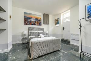 a white bedroom with a bed and a window at -75ACR- Setup for your relaxed & amazing stay in Leeds +12 photos