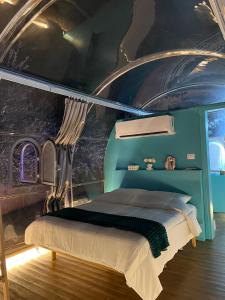 a bedroom with a bed in a room with a ceiling at Sial Skynest in Vlorë