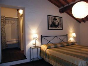 Tempat tidur dalam kamar di Fattoria San Paolo Agriturismo