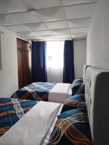 Postel nebo postele na pokoji v ubytování Serene Home