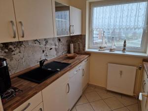 Kuchyň nebo kuchyňský kout v ubytování Ferienwohnung - Frische Brise 04 01